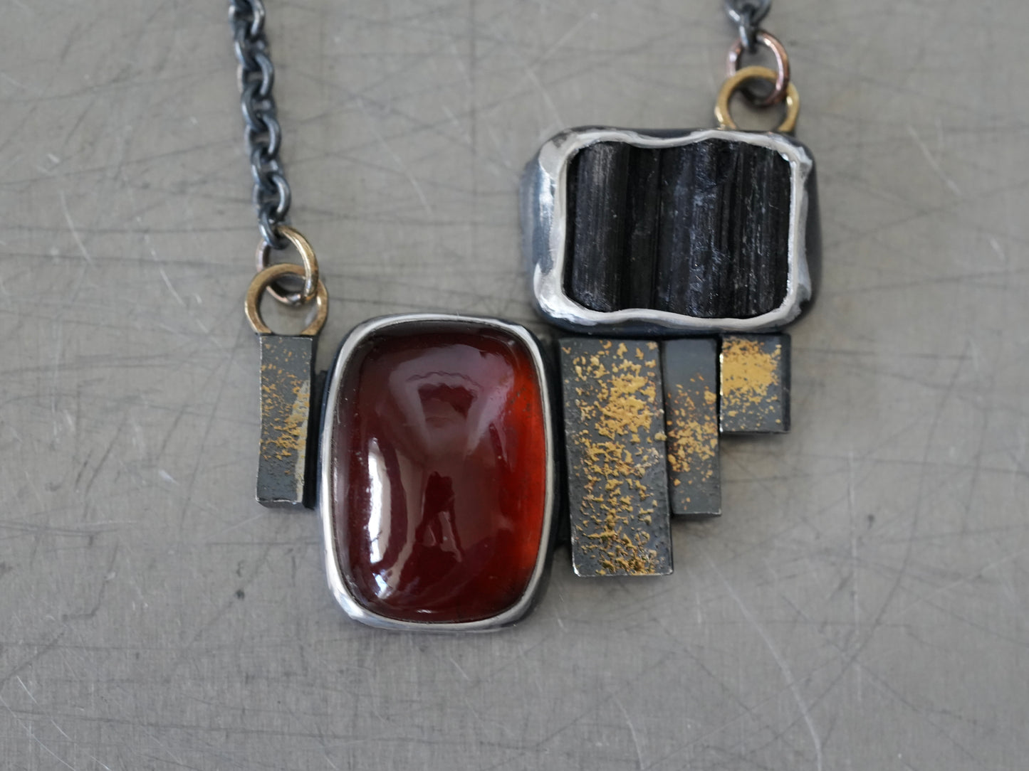 Statement garnet and tourmaline necklace with gold accents