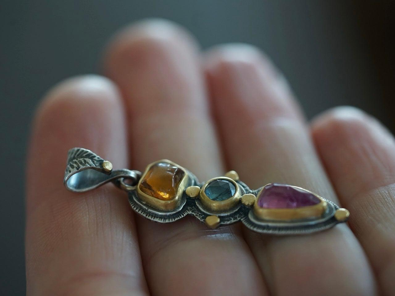 Tourmaline and sapphire pendant with gold accents