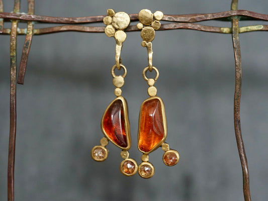 Exquisite, asymmetrical hessonite garnet and diamond drop earrings
