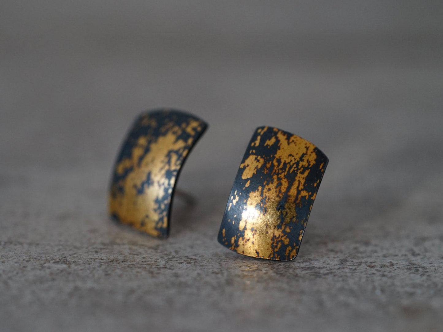 Modern gold on black stud earrings,