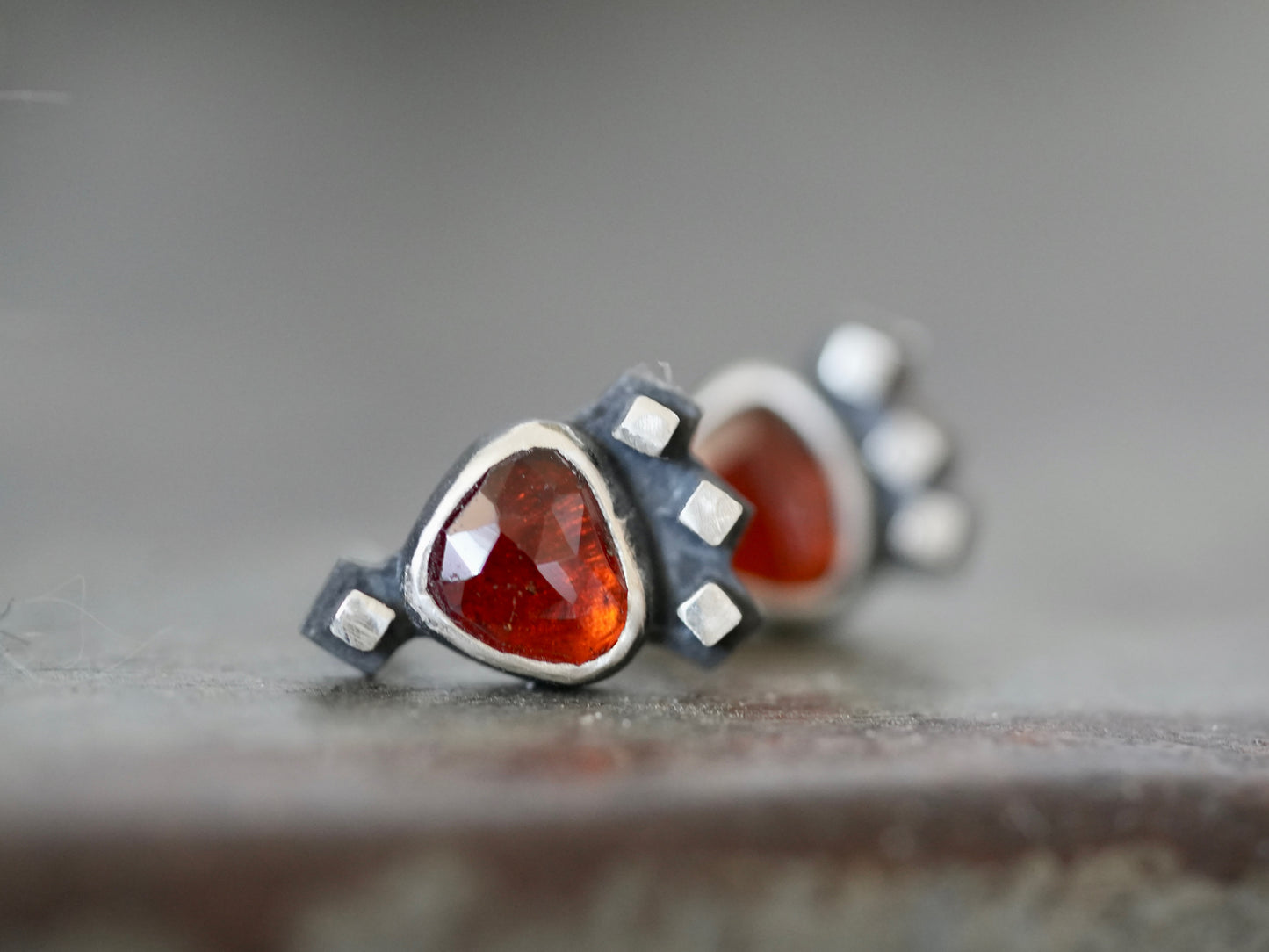 Garnet post earrings embellished with small silver cubes