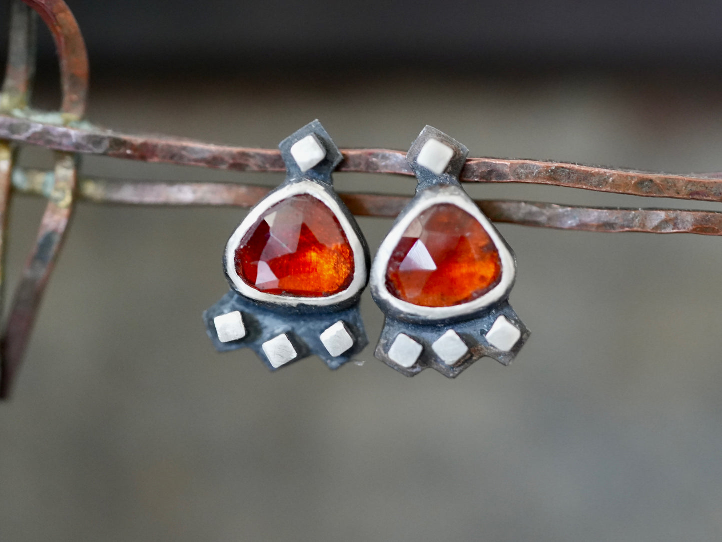 Garnet post earrings embellished with small silver cubes