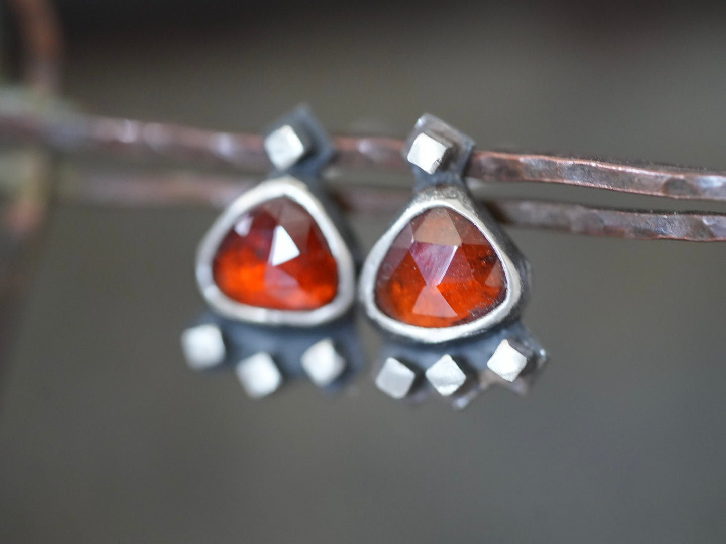 Garnet post earrings embellished with small silver cubes