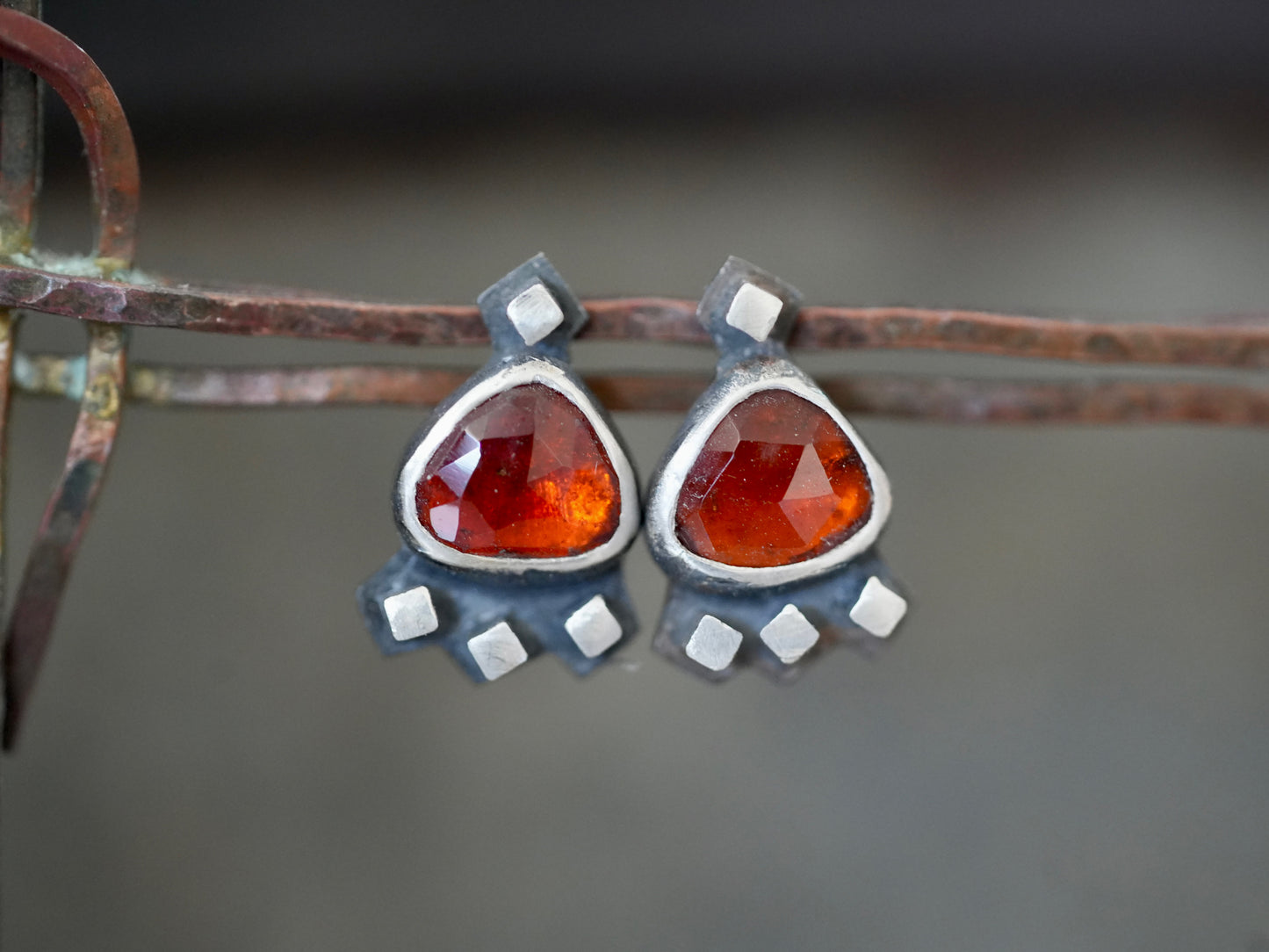 Garnet post earrings embellished with small silver cubes