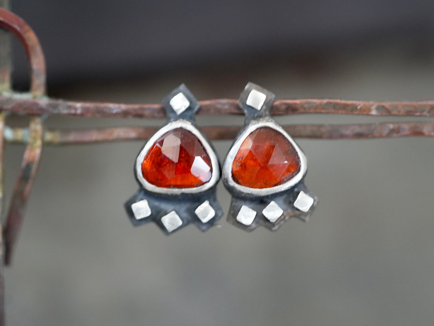 Garnet post earrings embellished with small silver cubes