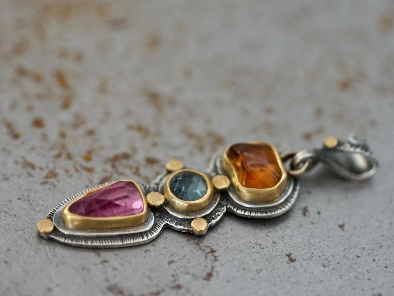 Tourmaline and sapphire pendant with gold accents