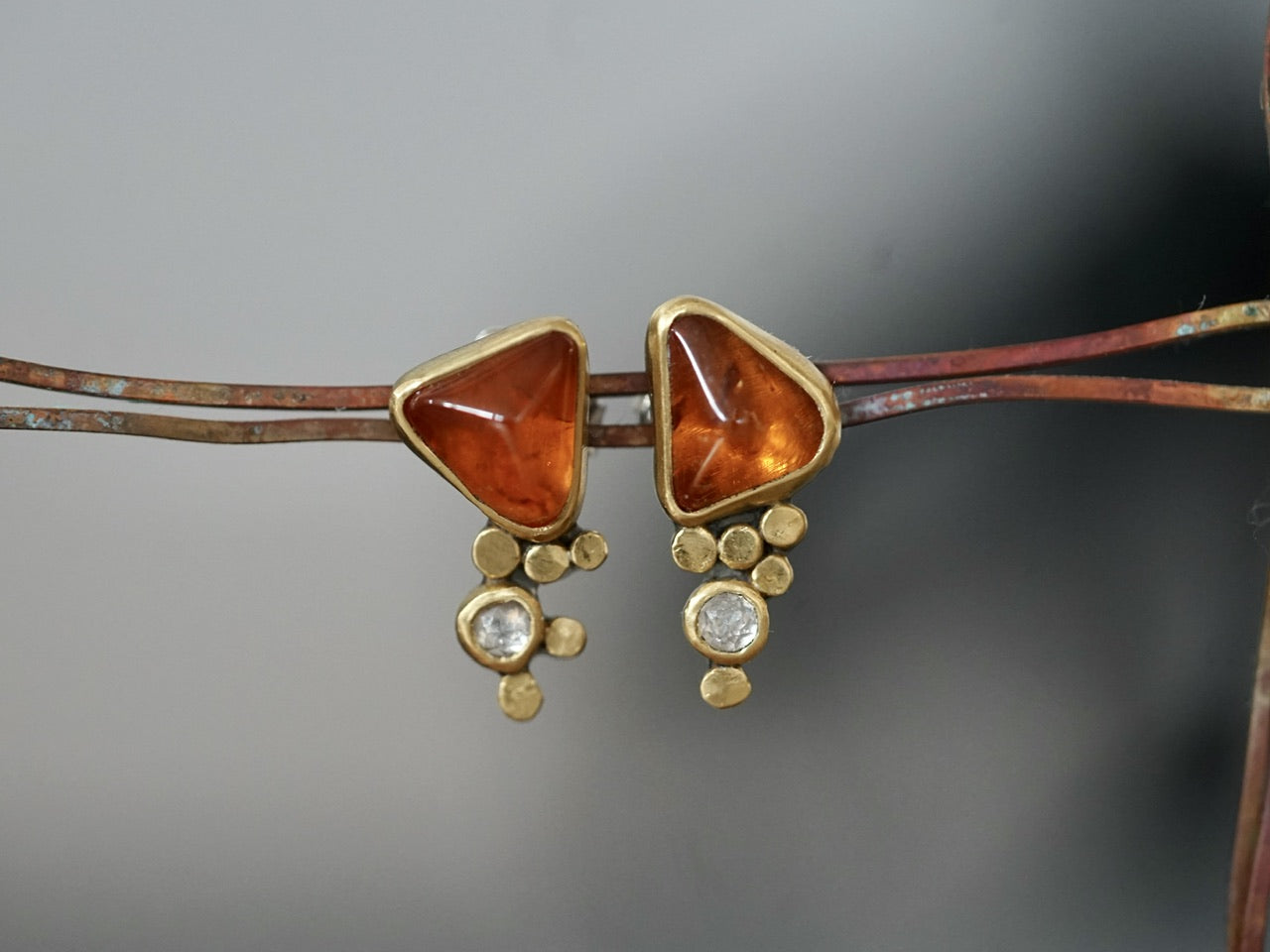 Hessonite garnet and diamond post earrings