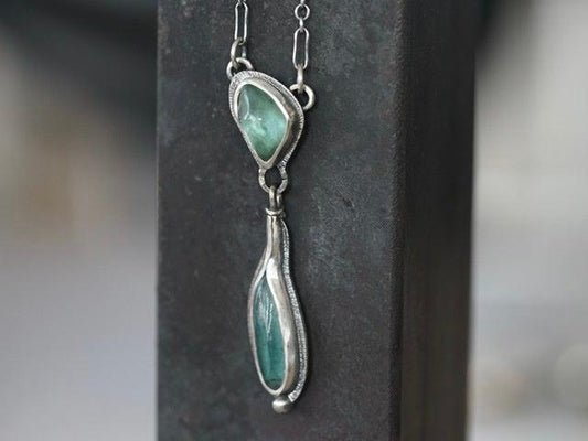 Carved teal blue tourmaline necklace