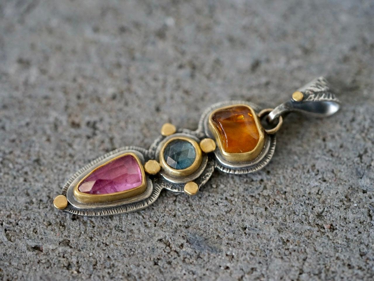 Tourmaline and sapphire pendant with gold accents