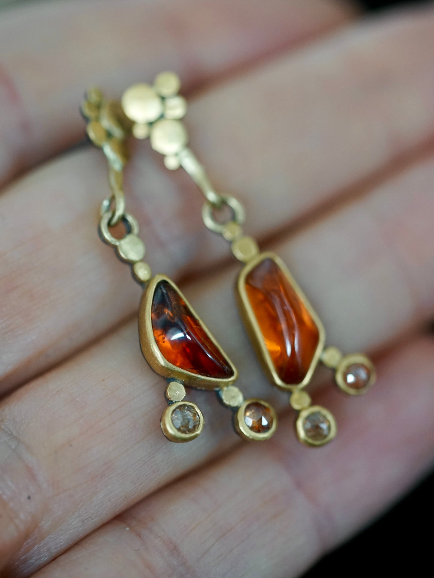 Exquisite, asymmetrical hessonite garnet and diamond drop earrings