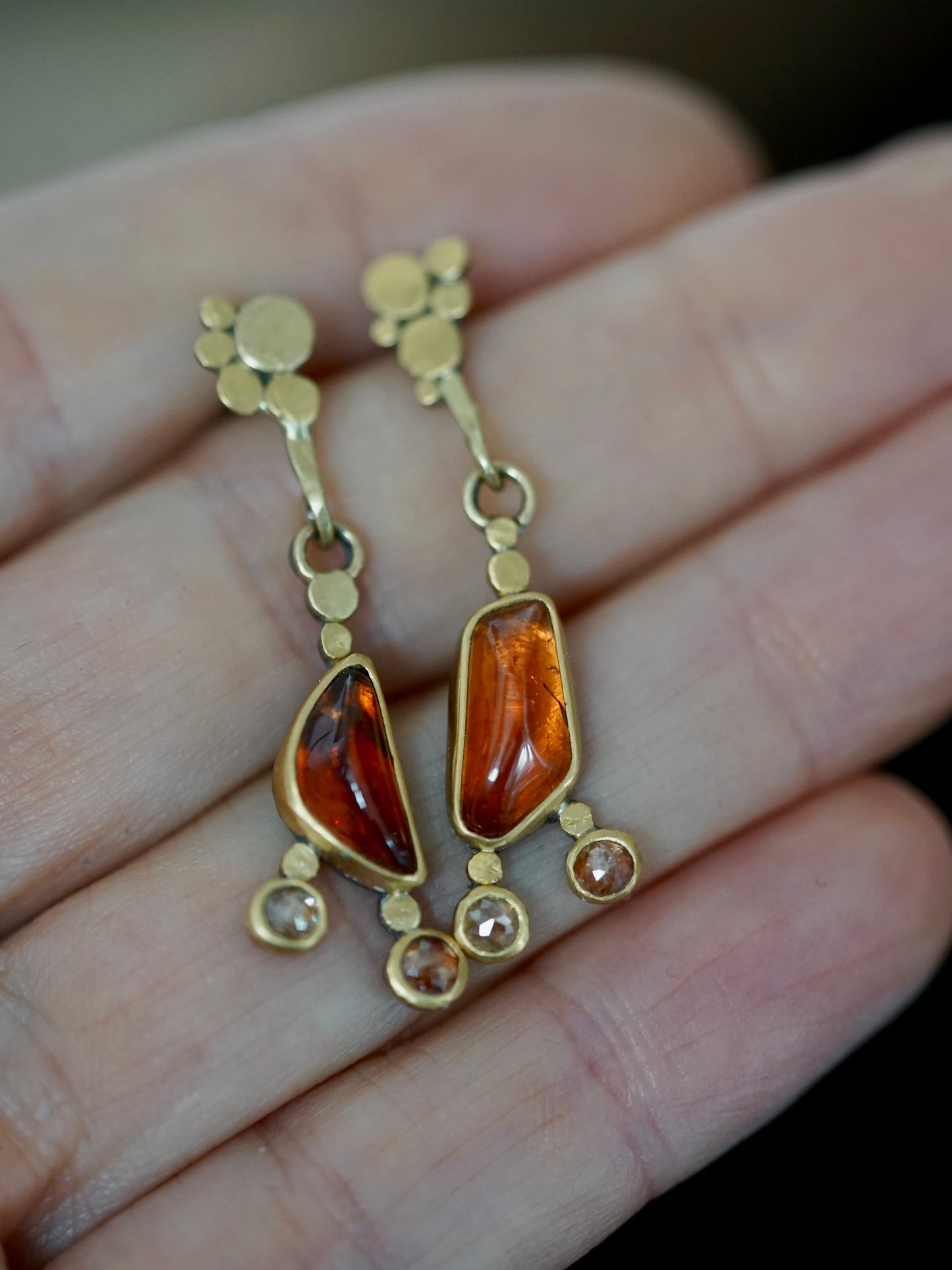 Exquisite, asymmetrical hessonite garnet and diamond drop earrings