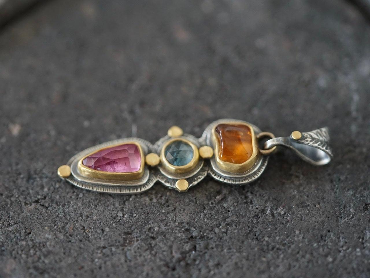 Tourmaline and sapphire pendant with gold accents