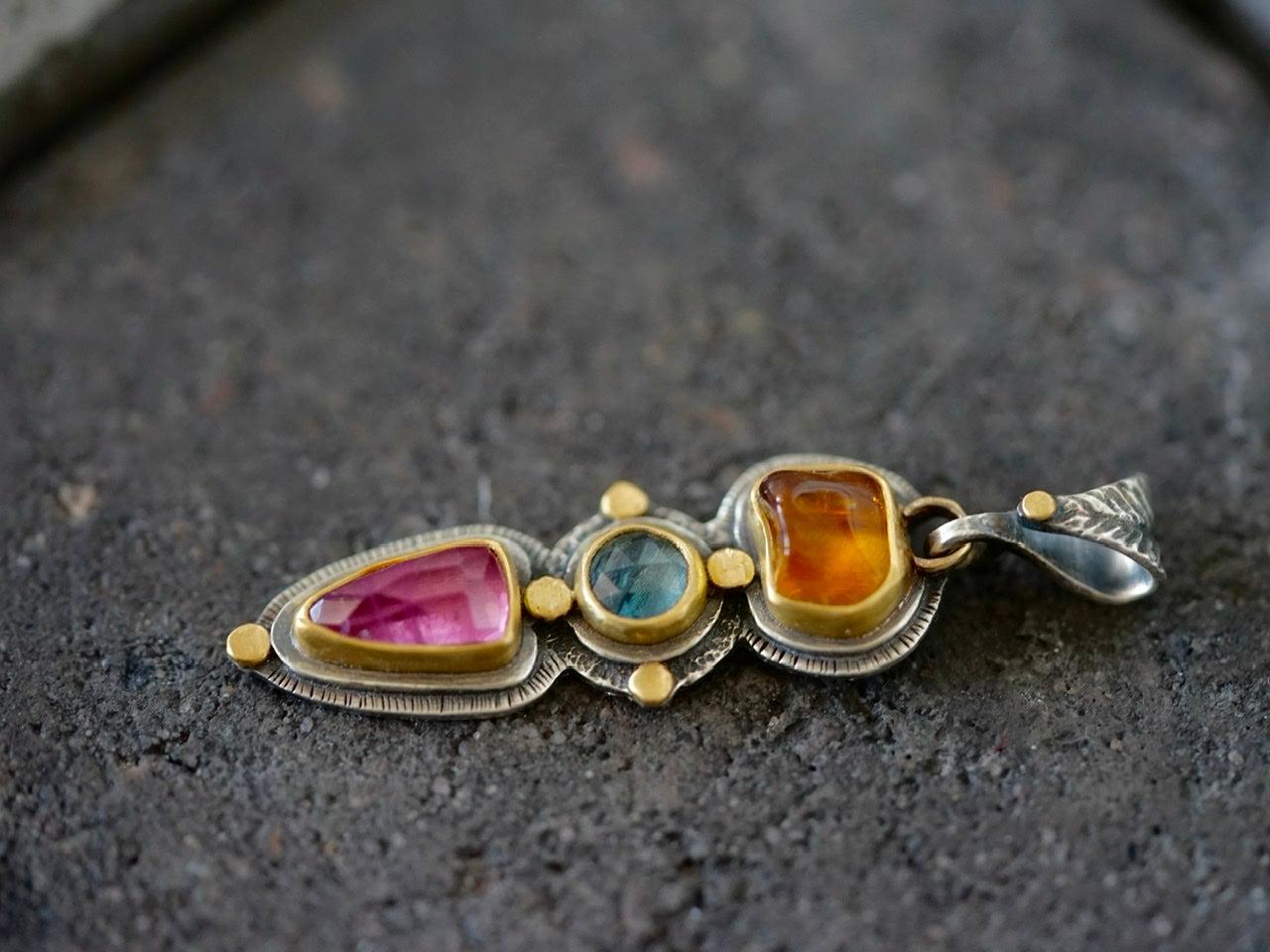 Tourmaline and sapphire pendant with gold accents