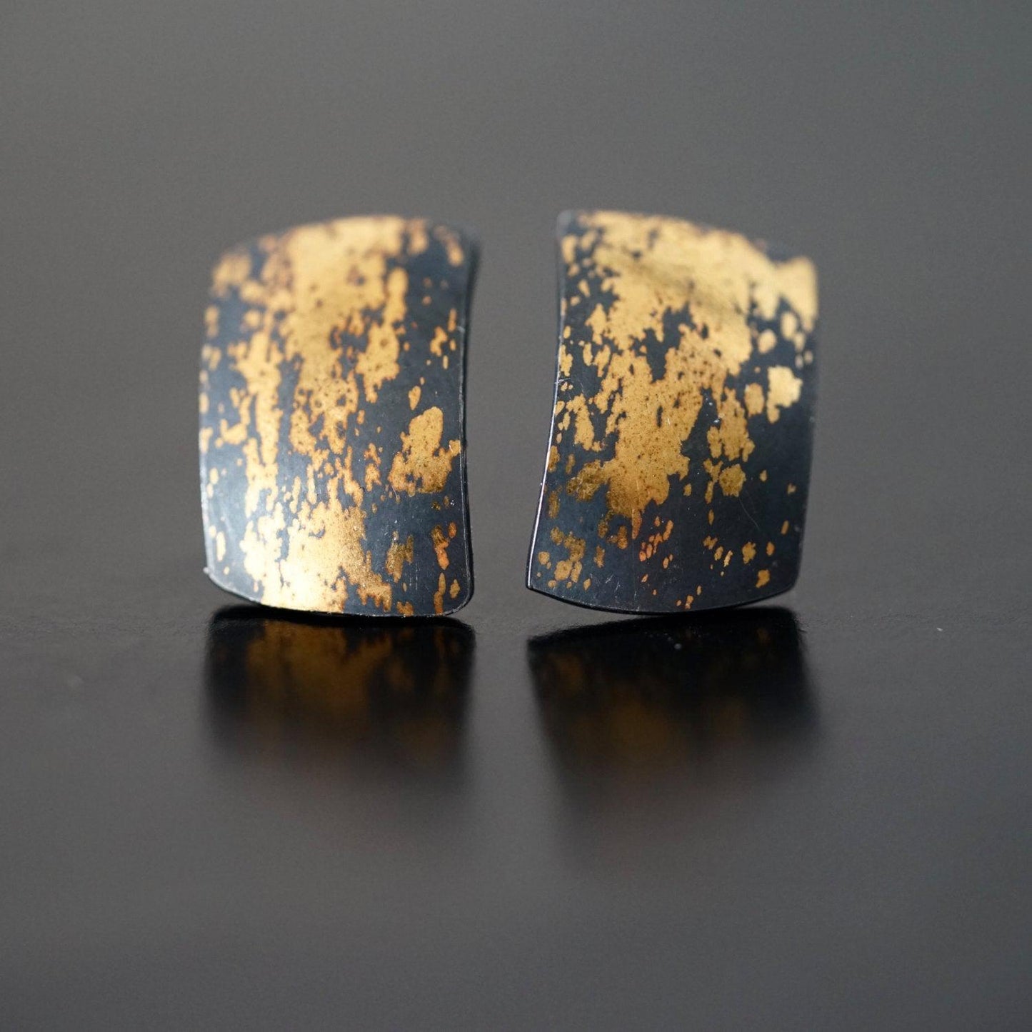 Modern gold on black stud earrings,