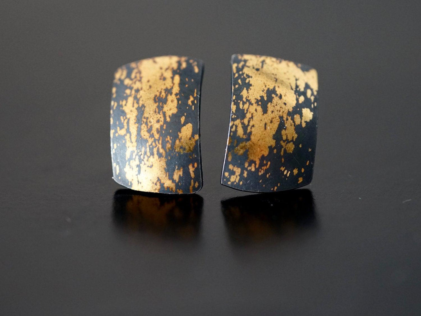 Modern gold on black stud earrings,