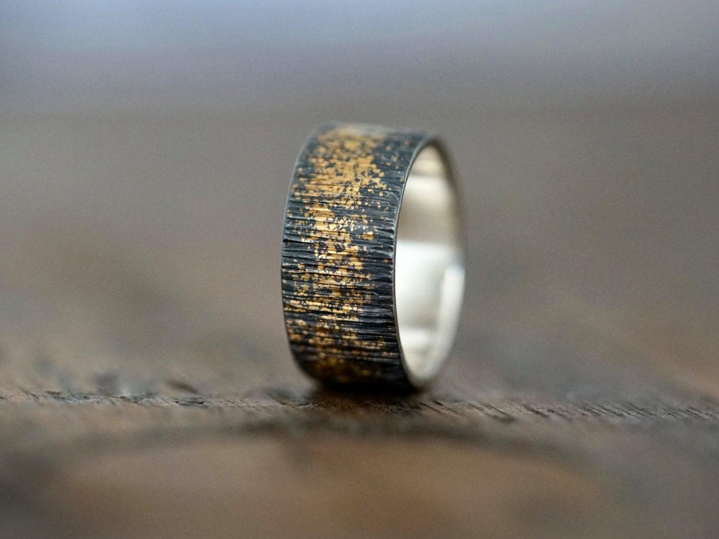 Gold on black wedding band, size 7.25