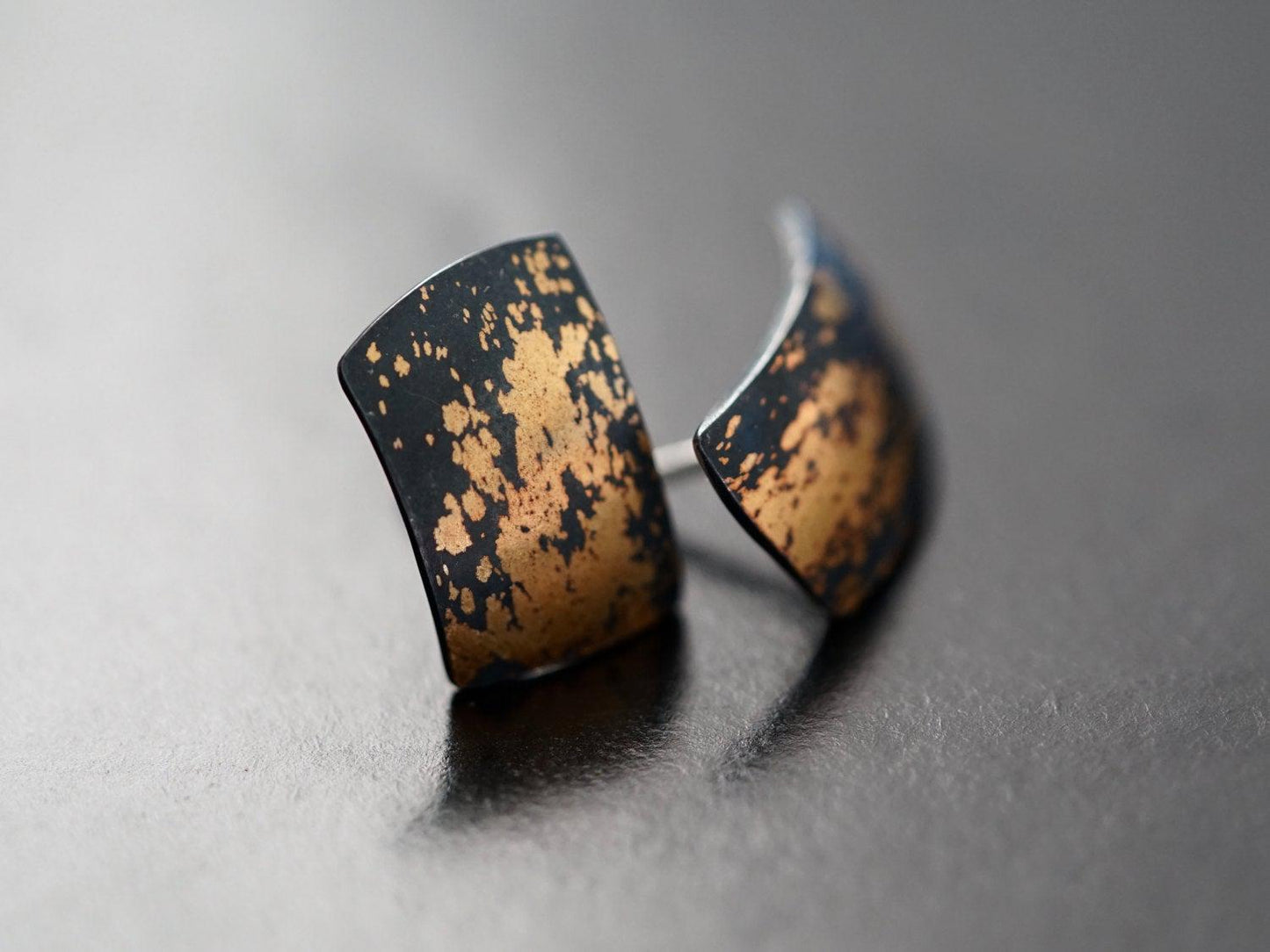 Modern gold on black stud earrings,