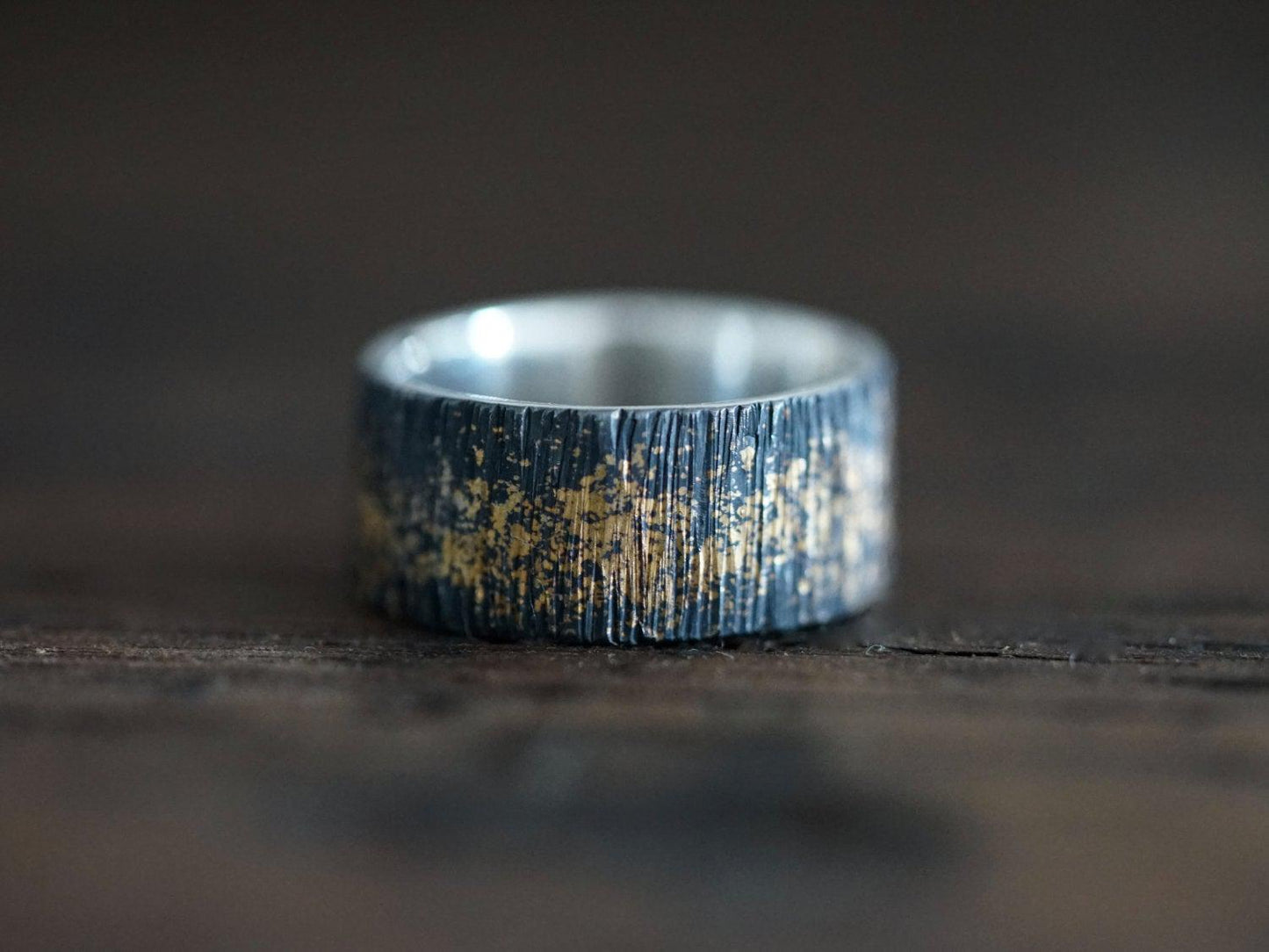 Gold on black wedding band, size 7.25