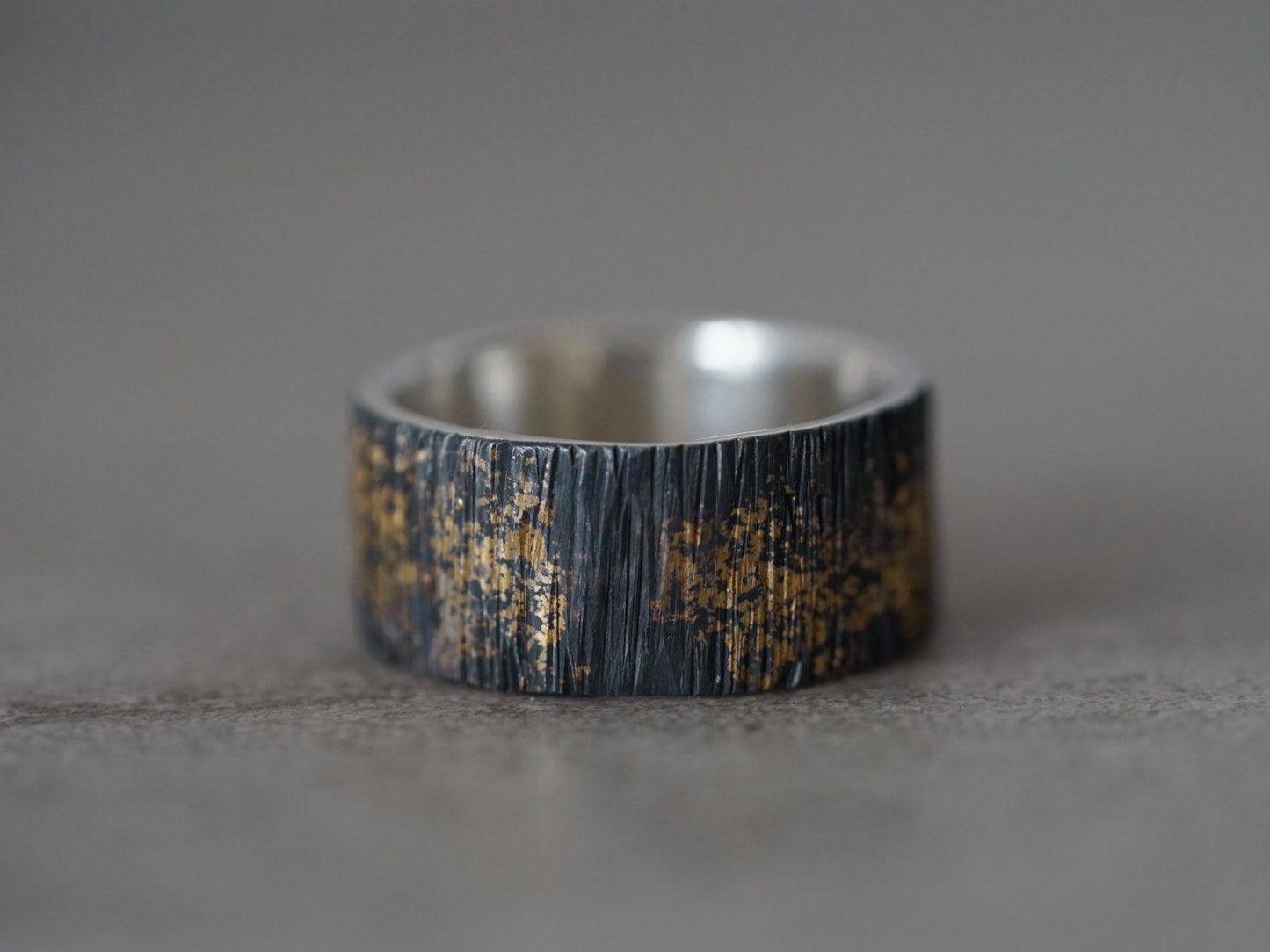 Gold on black wedding band, size 7.25