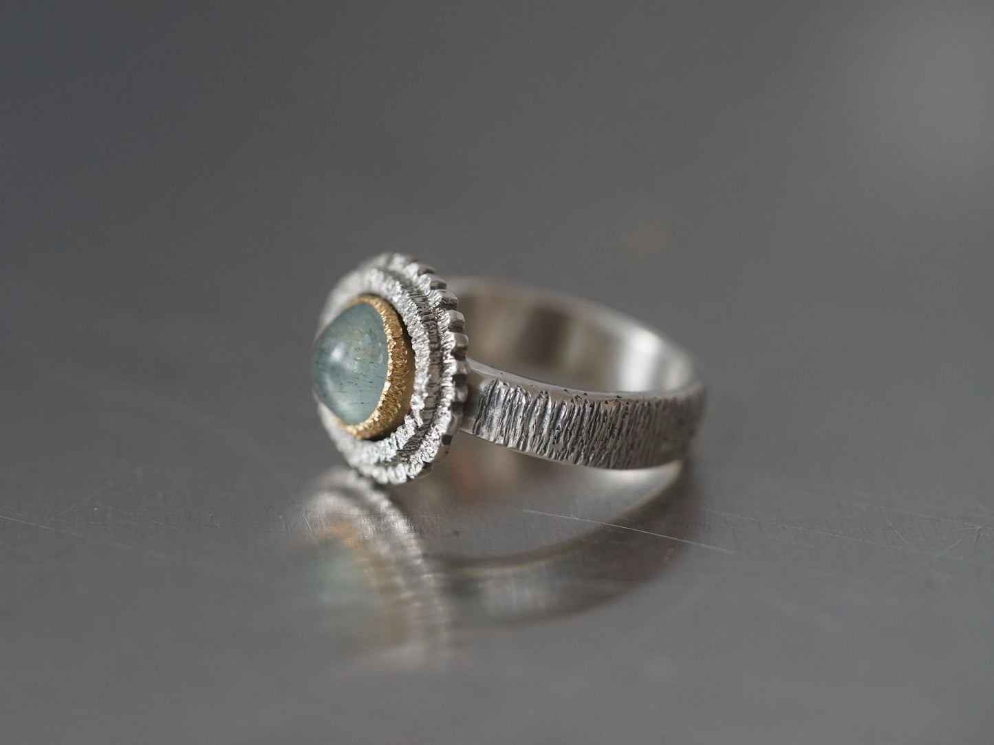 textured aquamarine and gold ring