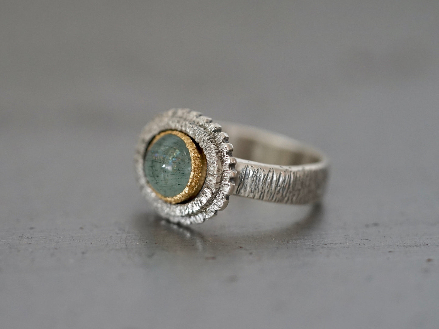 textured aquamarine and gold ring