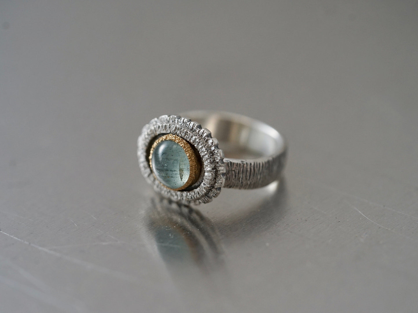 textured aquamarine and gold ring