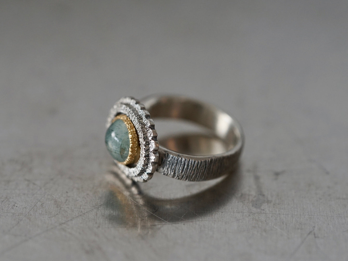 textured aquamarine and gold ring