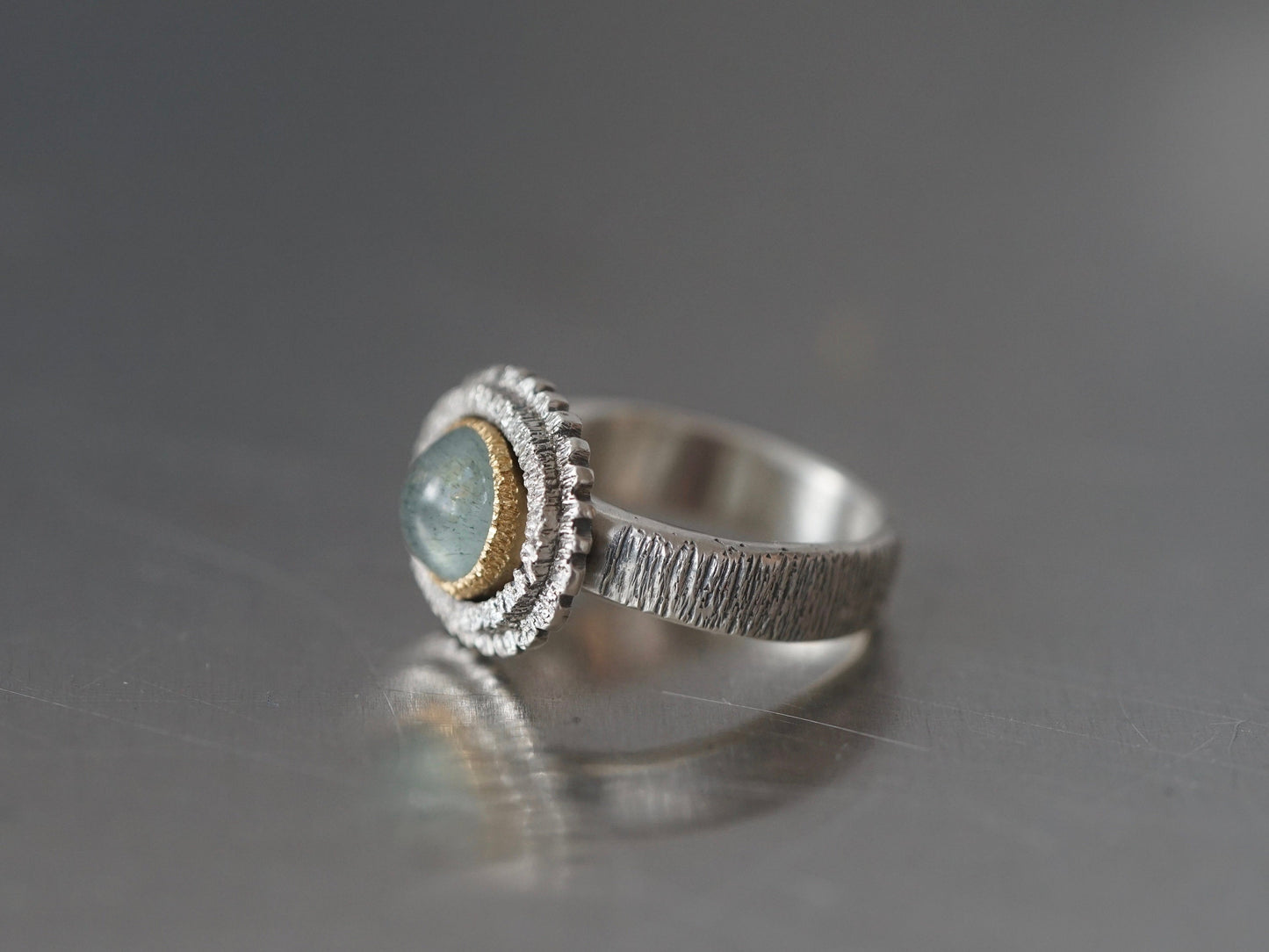 textured aquamarine and gold ring