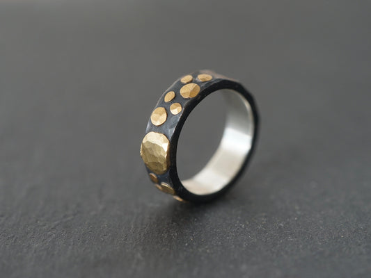 Gold and black ring, size 8