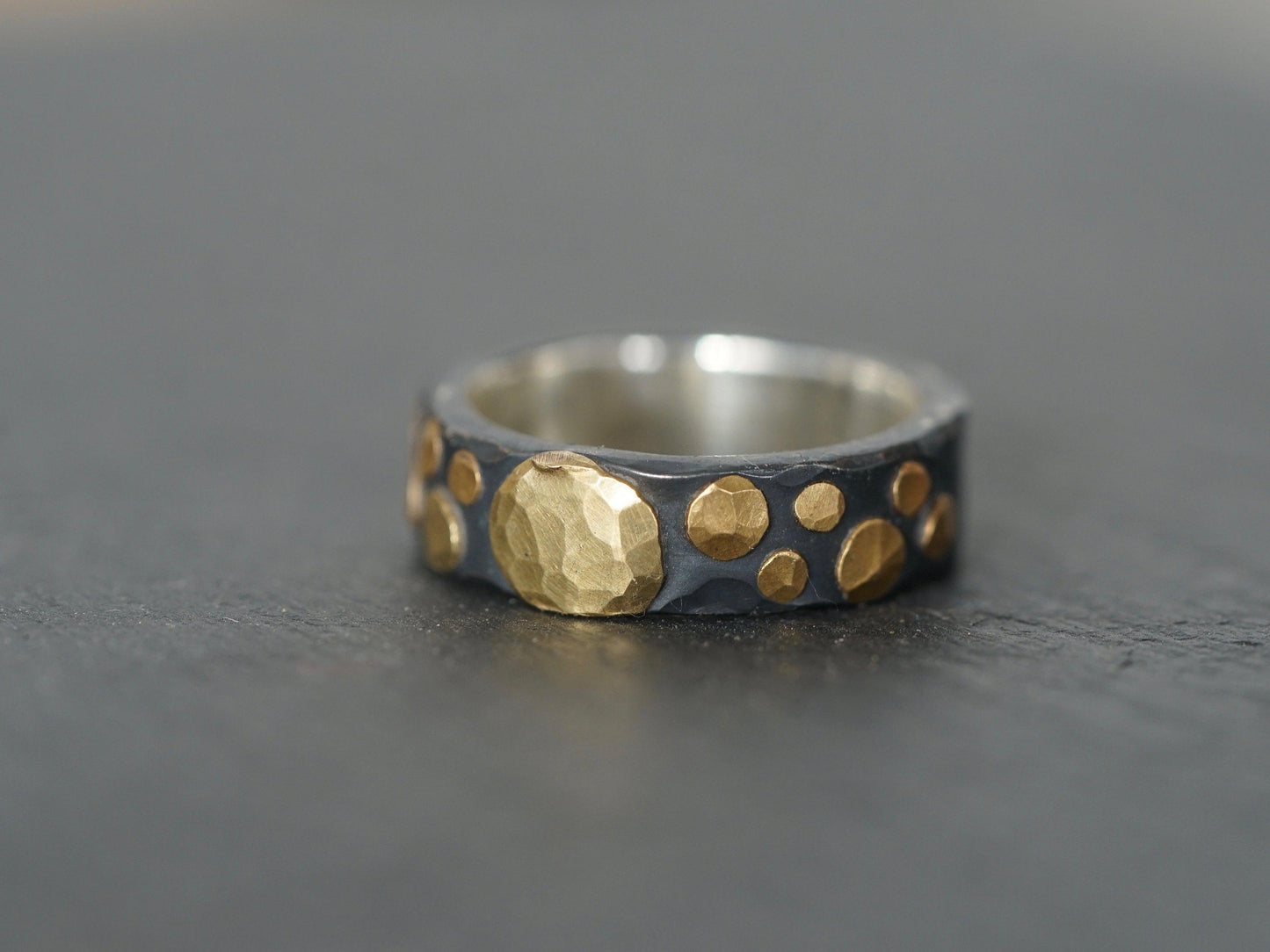 Gold and black ring, size 8