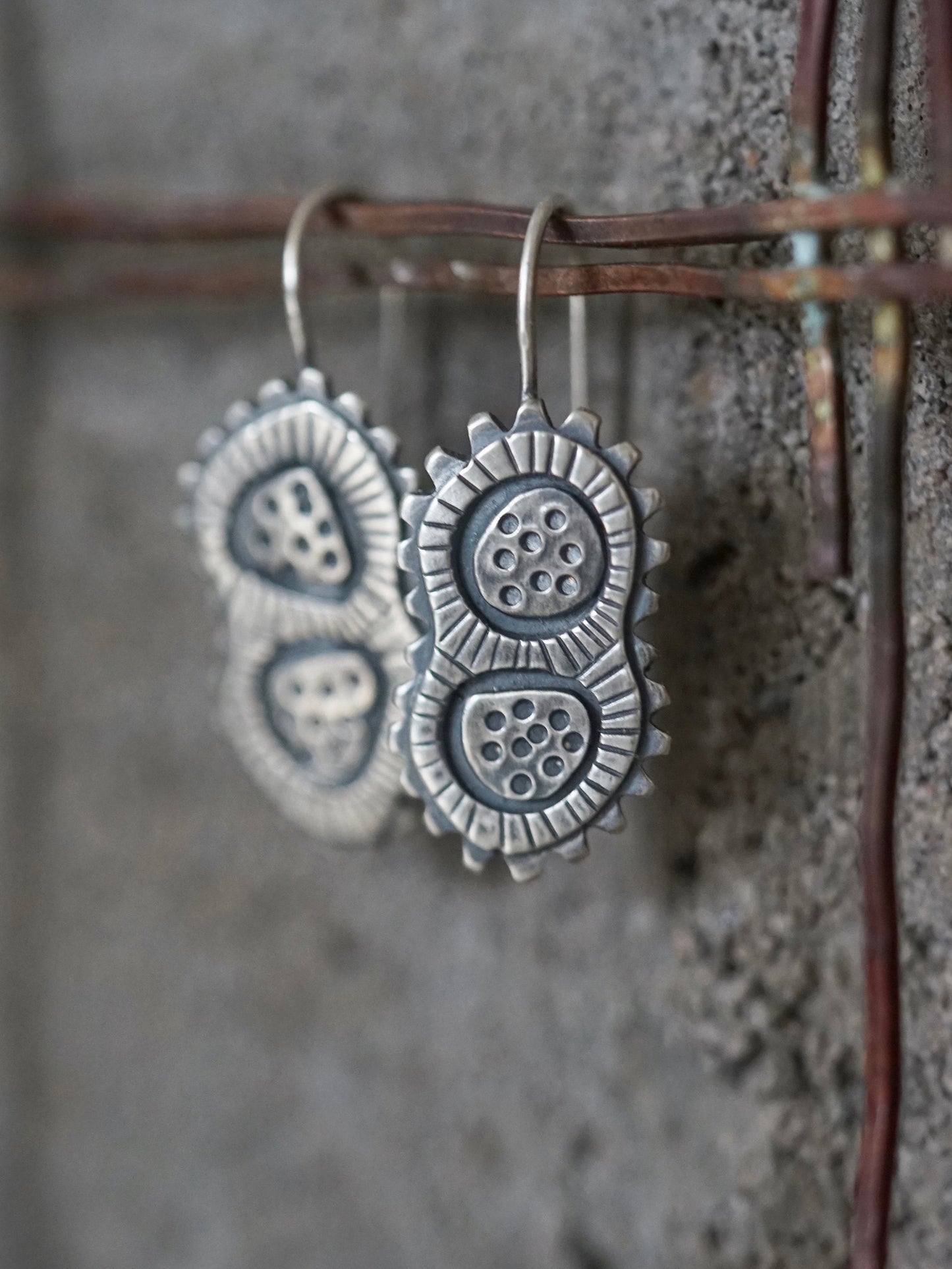 Sterling silver dangly microcosm earrings,