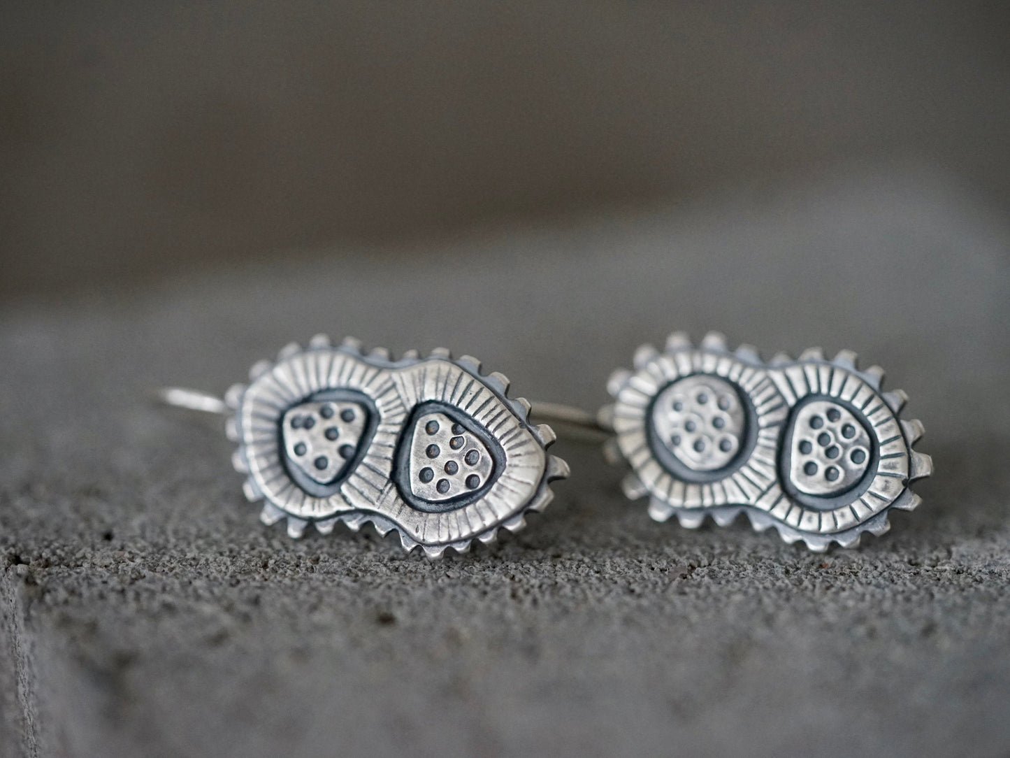 Sterling silver dangly microcosm earrings,