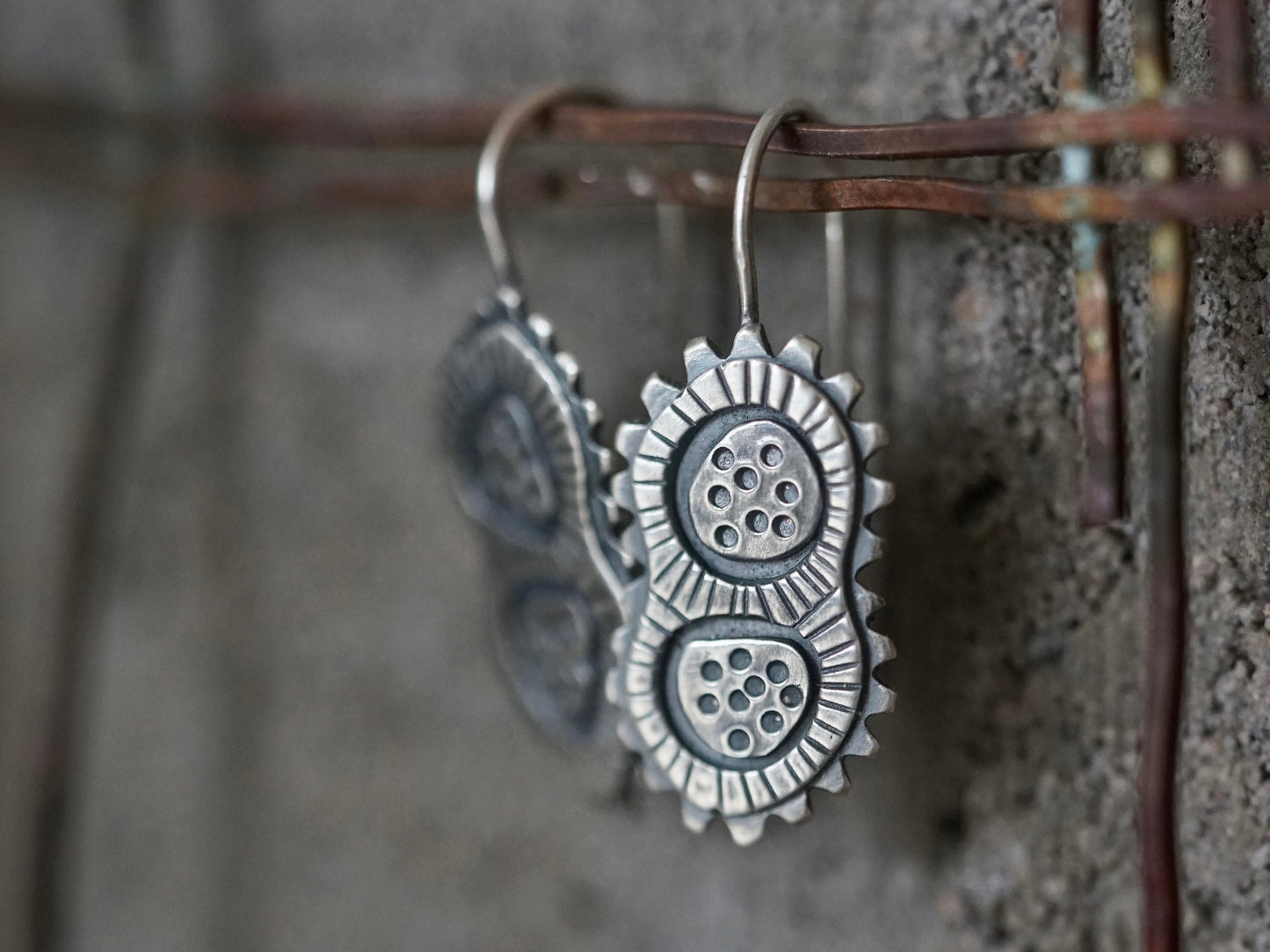 Sterling silver dangly microcosm earrings,