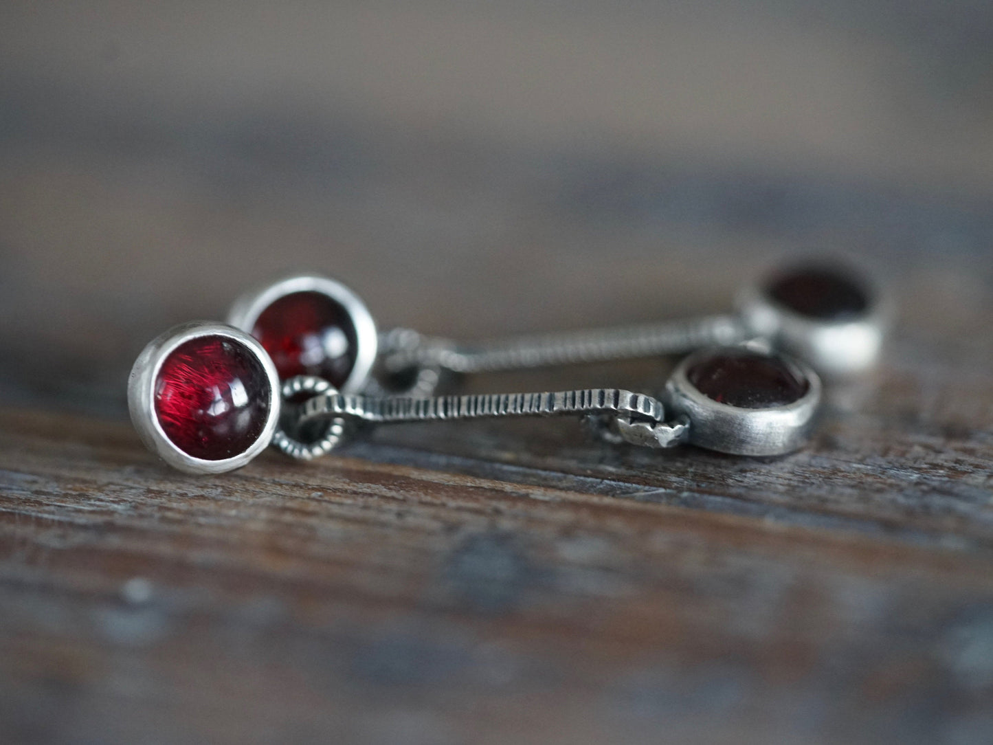 Linear garnet drop earrings