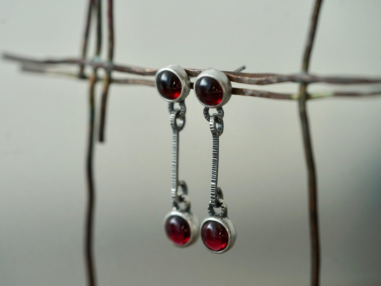 Linear garnet drop earrings